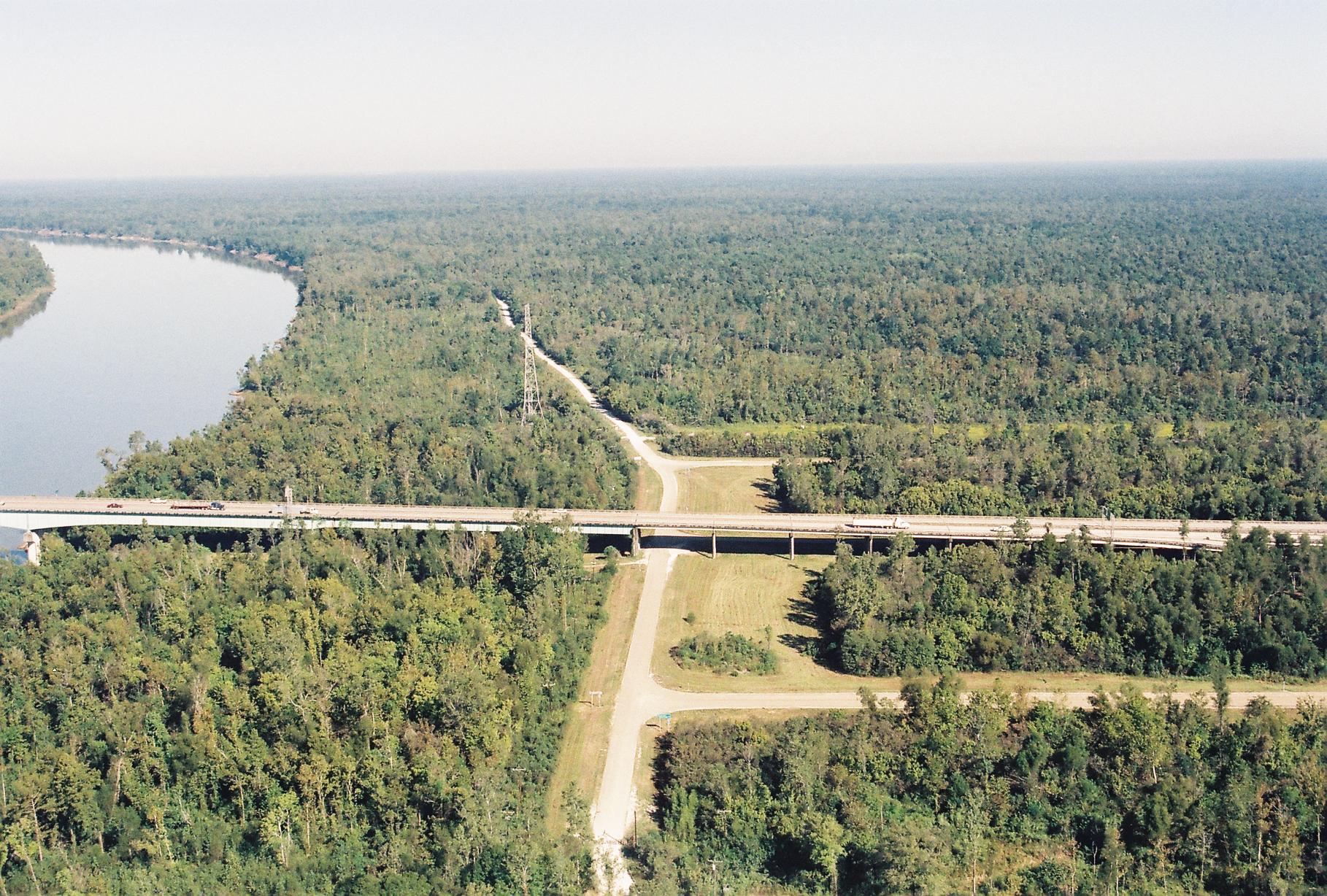 Aerial photo of the Whiskey Bay exit off of I-10. Long bridge crosses over river and swampland.